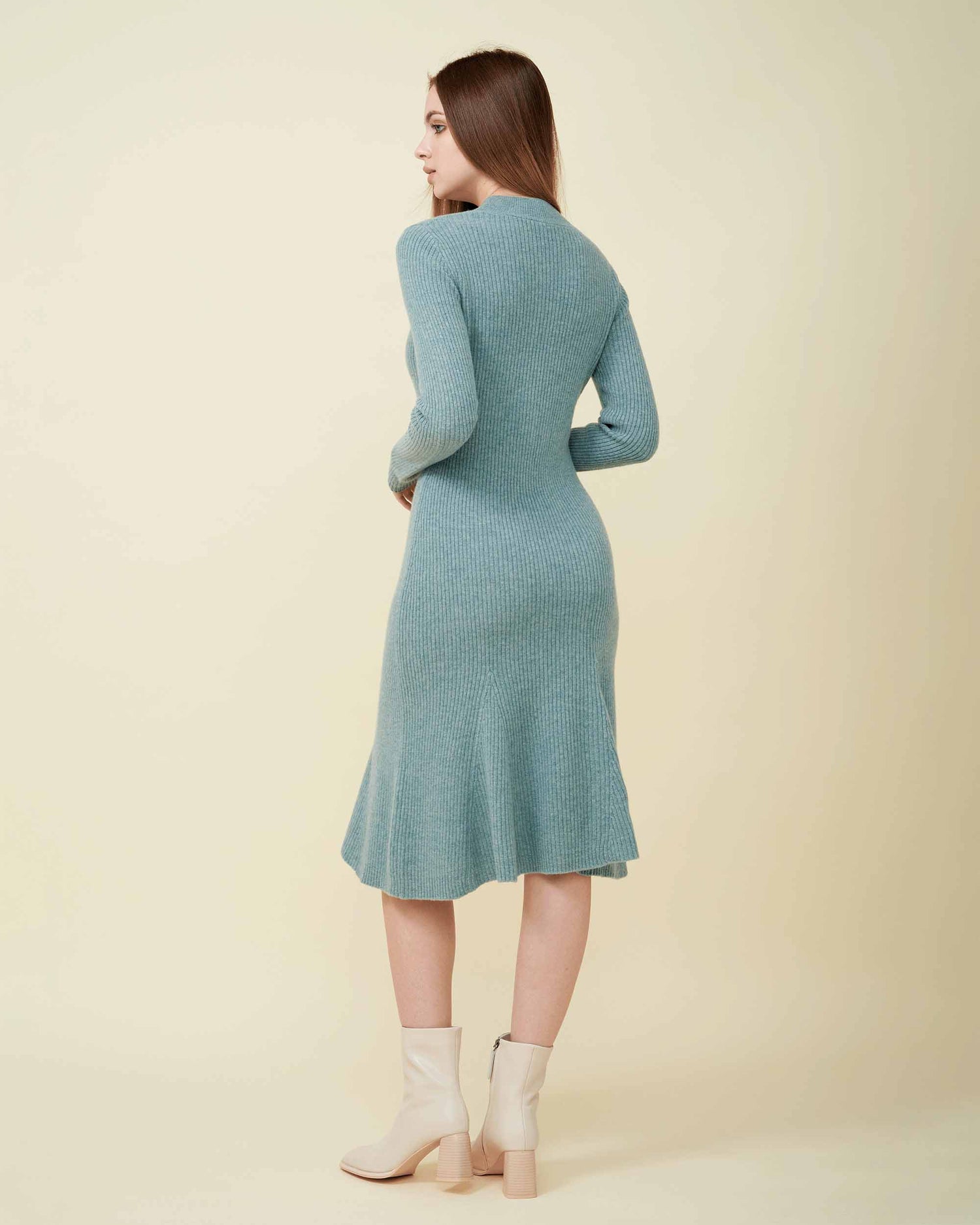 A back view of a wool sweater dress , rib knit texture , Confident look ,100% cashmere DAVINII