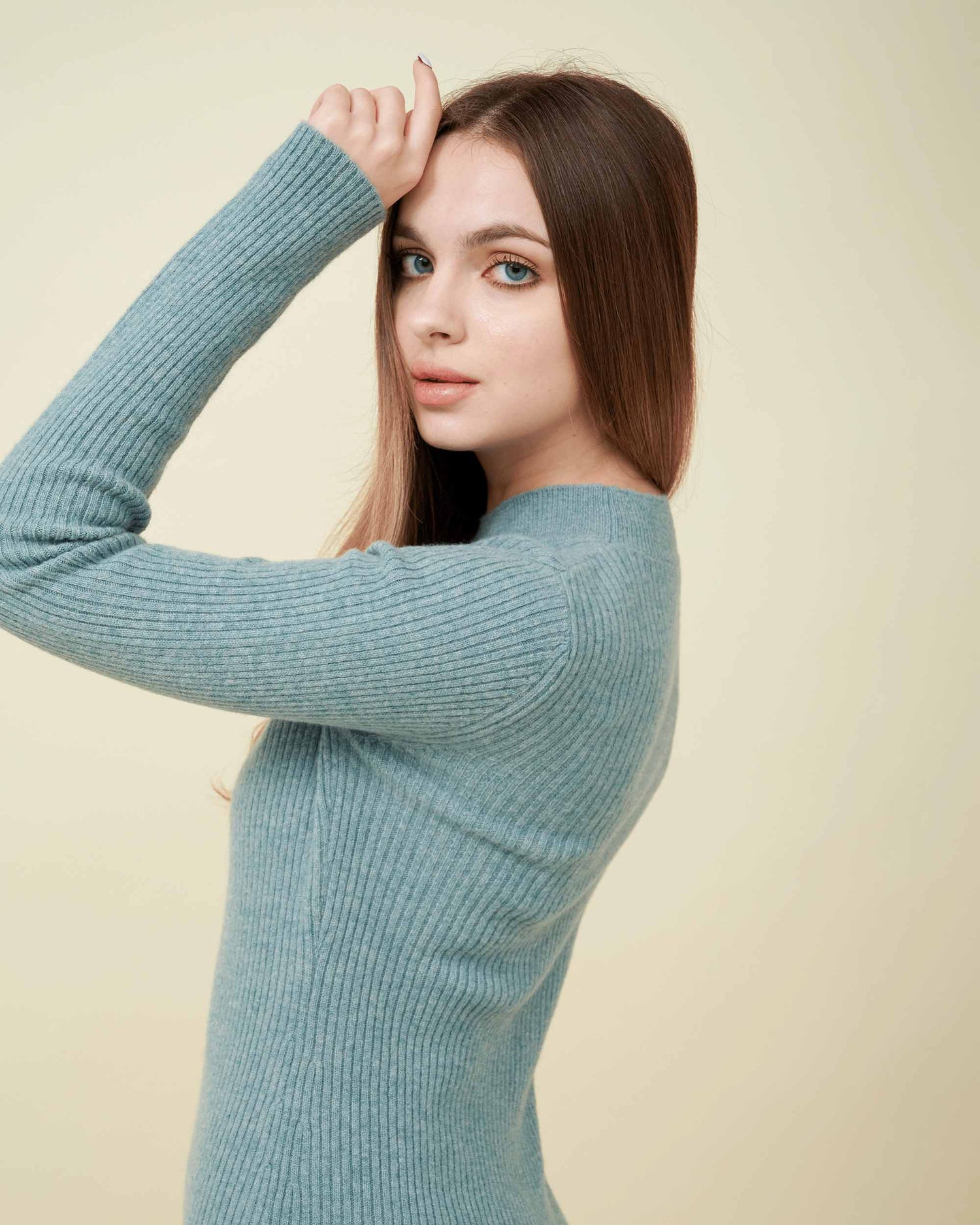 A side view of a wool sweater dress , rib knit texture , Confident look ,100% cashmere DAVINII
