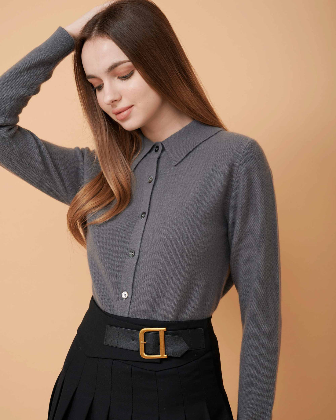 A front view of a button-down cashmere sweater in Grey showing the fit , 100% Cashmere ,DAVINII