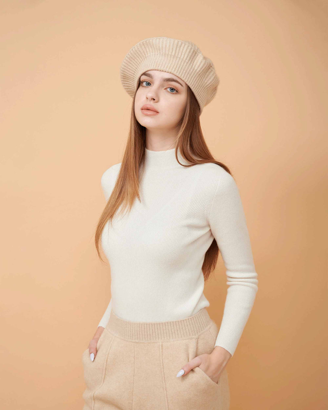 A front view of a plain cashmere sweater in white showing the fit , 100% Cashmere ,DAVINII