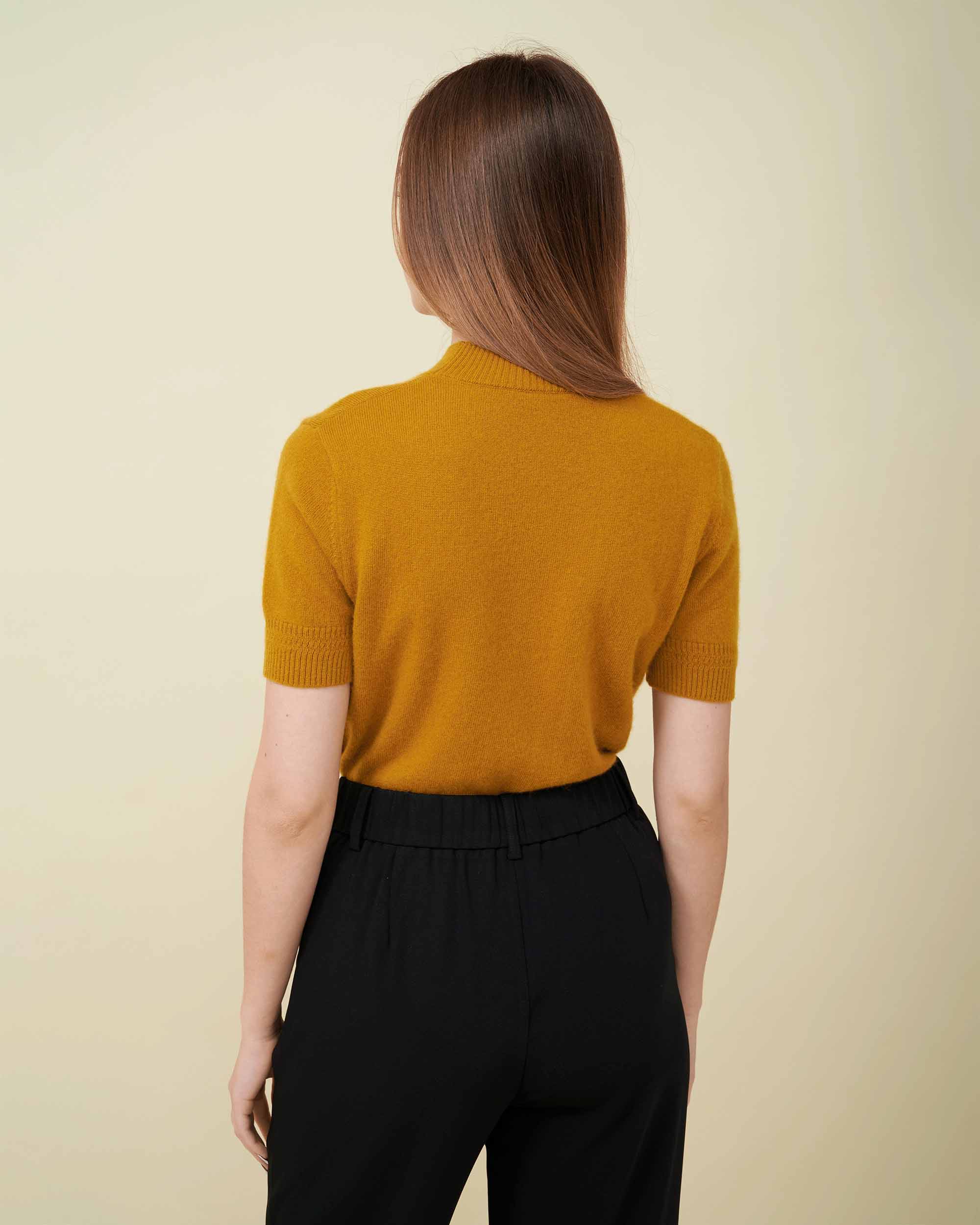A back view of a cashmere pullover in mustard showing the  fit, Cashmere 100% , very soft and comfy